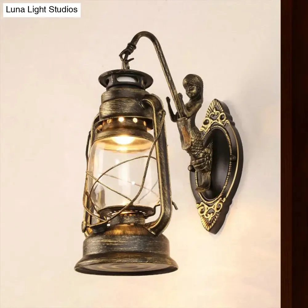 Coastal Bedroom Wall Light with Lantern Shade - Clear Glass Sconce in Black/Antique Brass/Weathered Copper with Mermaid